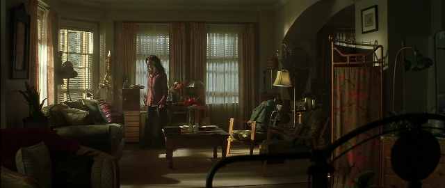 Wide shot frame from Blade — standing, room, table