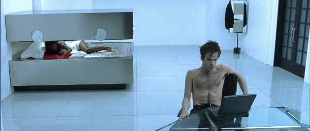 Wide shot frame from Blade — sitting, room, bed