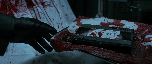 Frame from Blade — room, bed, hand