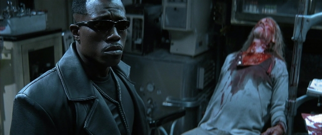 Medium shot frame from Blade — room, bed, jacket