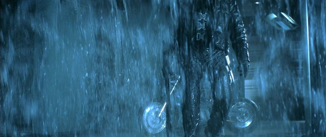 Wide shot frame from Blade — standing, street, hand