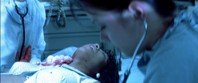 Wide shot frame from Blade — standing, room, bed