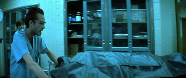 Frame from Blade — room, bed, suit