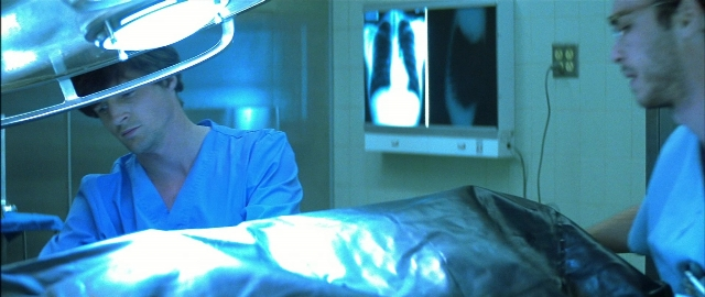 Wide shot frame from Blade — standing, room, bed
