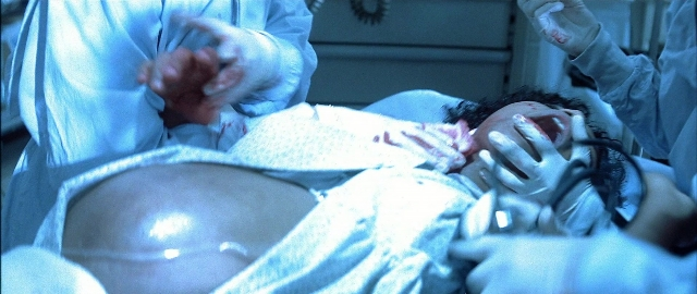 Frame from Blade — room, bed, hand