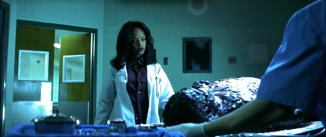 Wide shot frame from Blade — standing, room, bed