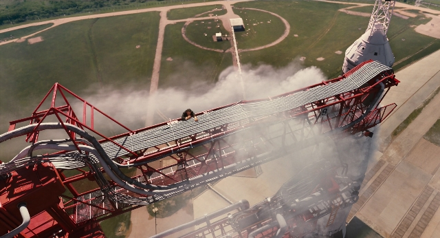 Wide shot frame from Men in Black 3 — car, smoke, person