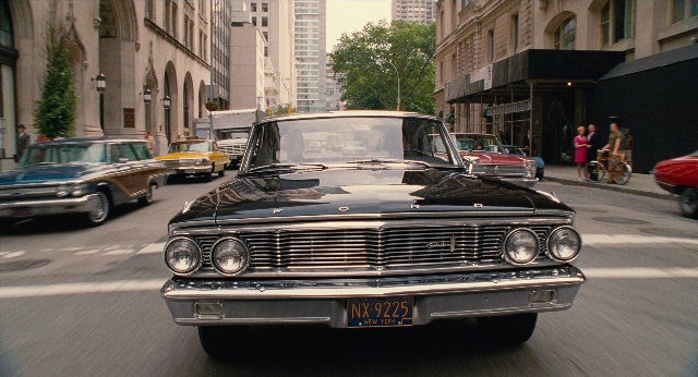 Wide shot frame from Men in Black 3 — walking, plate, street