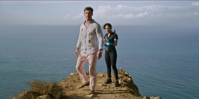 Wide shot frame from Men in Black International — standing, hand, shirt