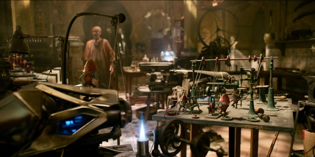 Wide shot frame from Men in Black International — standing, face, wheel