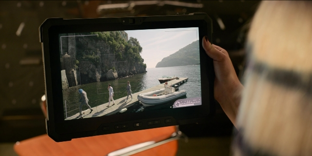 Wide shot frame from Men in Black International — walking, hand, water