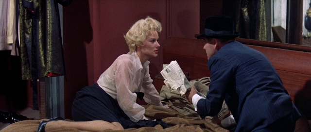 Wide shot frame from Pocketful of Miracles — sitting, room, bed