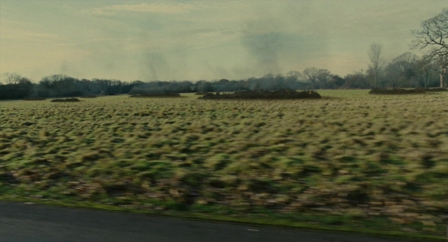 Frame from Children of Men — street, smoke