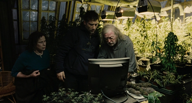 Wide shot frame from Children of Men — standing, walking, shirt