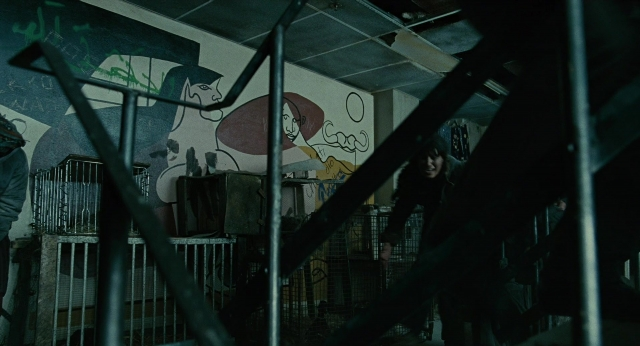 Wide shot frame from Children of Men — people, action, standing