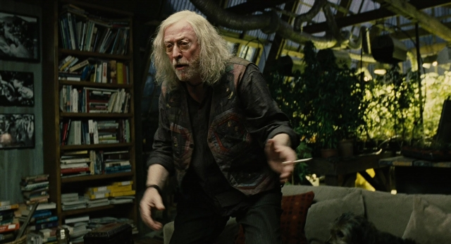 Wide shot frame from Children of Men — book, standing, room