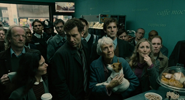 Wide shot frame from Children of Men — standing, dog, food