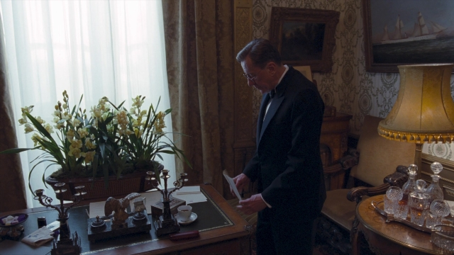 Wide shot frame from The King's Speech — standing, room, table