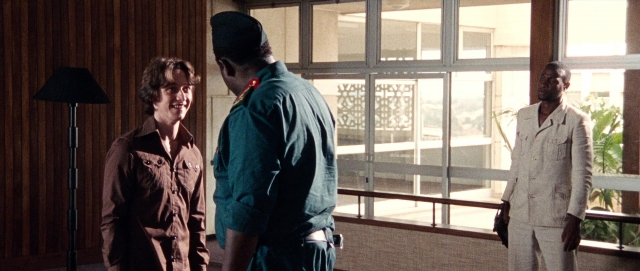 Wide shot frame from The Last King of Scotland — standing, room, dialogue