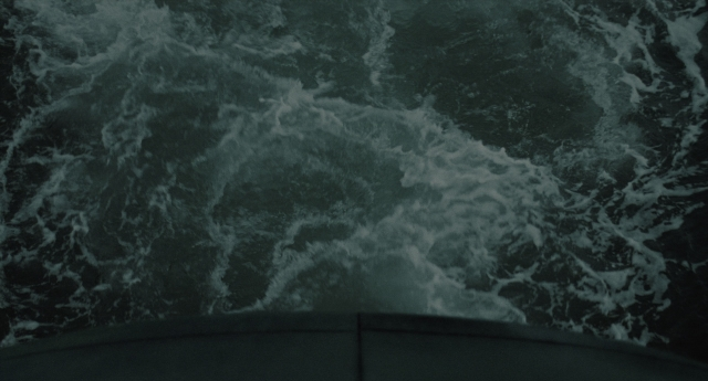 Wide shot frame from The Ring — car, water, boat