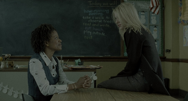 Wide shot frame from The Ring — sitting, table, dialogue