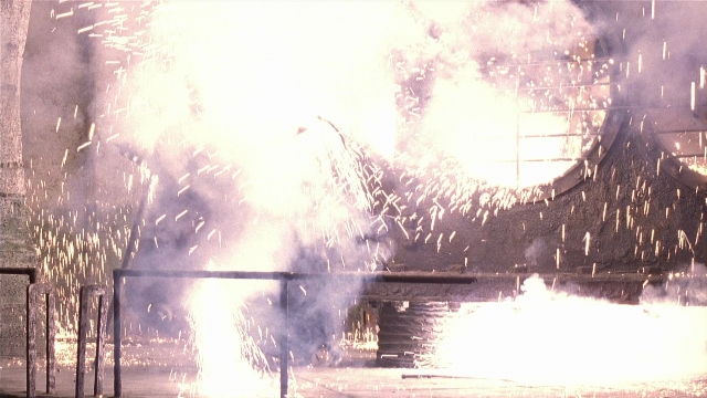 Wide shot frame from Batman Returns — pipe, fountain, running