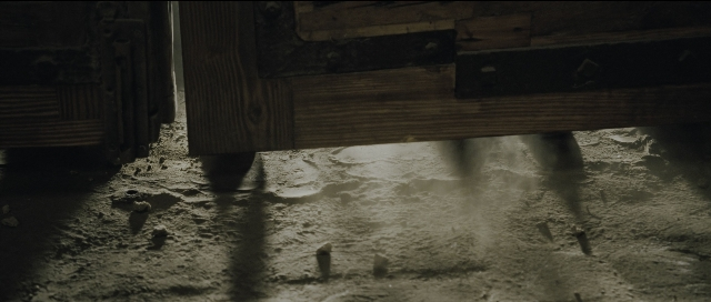 Wide shot frame from Perfume: The Story of a Murderer — room, table, furniture