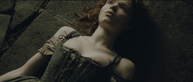Wide shot frame from Perfume: The Story of a Murderer — dress, face, hair