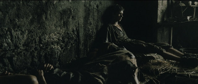 Wide shot frame from Perfume: The Story of a Murderer — sitting, room, bed