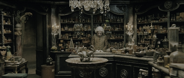 Wide shot frame from Perfume: The Story of a Murderer — furniture, bird