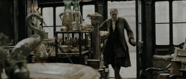 Wide shot frame from Perfume: The Story of a Murderer — walking, room, table