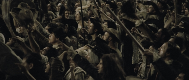 Wide shot frame from Perfume: The Story of a Murderer — room, person, human face