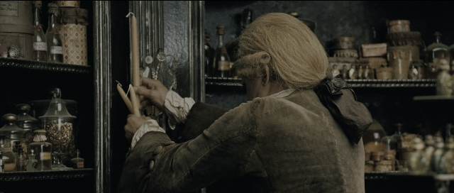 Wide shot frame from Perfume: The Story of a Murderer — standing, hand, hair