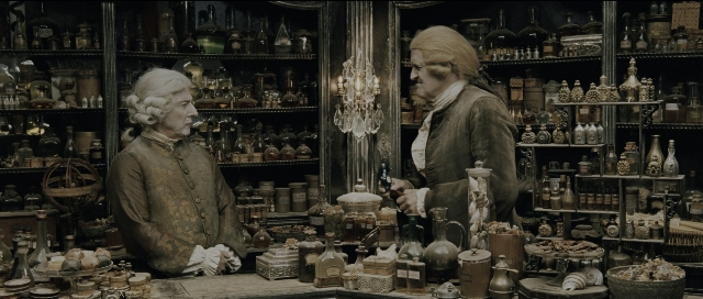 Wide shot frame from Perfume: The Story of a Murderer — standing, hat, coat