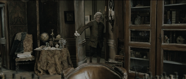 Wide shot frame from Perfume: The Story of a Murderer — standing, room, table