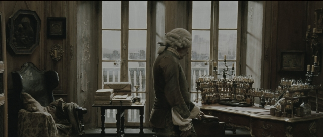Wide shot frame from Perfume: The Story of a Murderer — standing, room, table