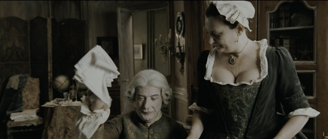 Wide shot frame from Perfume: The Story of a Murderer — sitting, standing, room