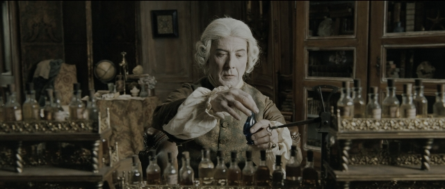Wide shot frame from Perfume: The Story of a Murderer — sitting, room, table