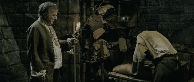 Wide shot frame from Perfume: The Story of a Murderer — standing, room, bed