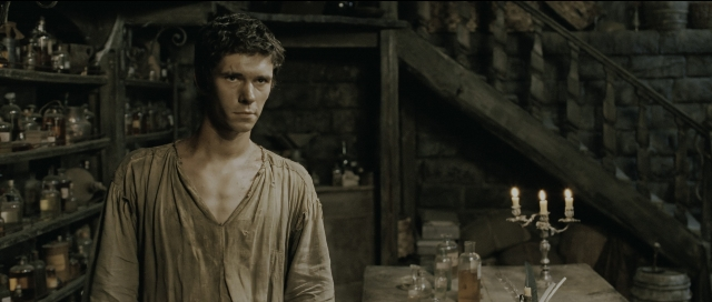 Wide shot frame from Perfume: The Story of a Murderer — standing, room, table