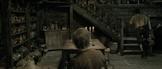 Wide shot frame from Perfume: The Story of a Murderer — sitting, standing, room