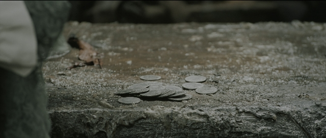 Wide shot frame from Perfume: The Story of a Murderer — coin