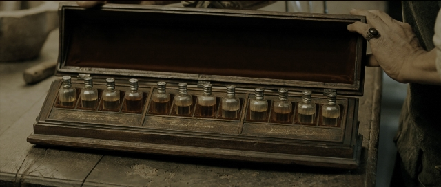 Wide shot frame from Perfume: The Story of a Murderer — glass, box
