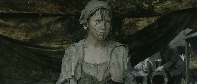 Wide shot frame from Perfume: The Story of a Murderer — standing, dress, face