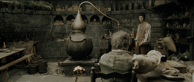 Wide shot frame from Perfume: The Story of a Murderer — sitting, standing, coat