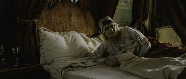 Wide shot frame from Perfume: The Story of a Murderer — room, table, bed