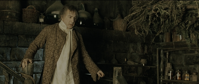 Wide shot frame from Perfume: The Story of a Murderer — standing, room, coat
