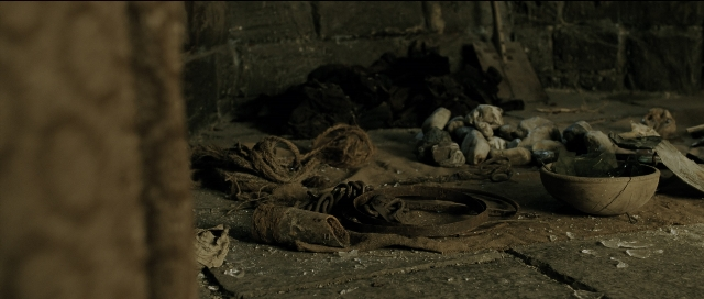 Wide shot frame from Perfume: The Story of a Murderer — room, footwear