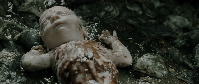 Wide shot frame from Perfume: The Story of a Murderer — bed, person, human face