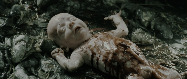 Wide shot frame from Perfume: The Story of a Murderer — bed, person, human face